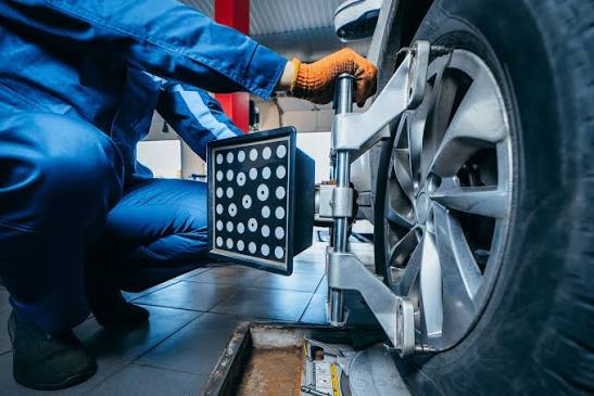 Wheel alignment equipment attached to a car wheel